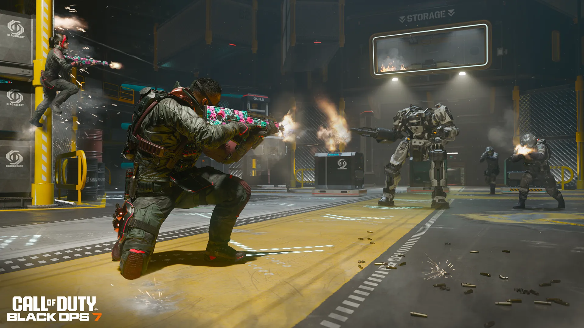 Soldiers fire rifles at a large combat robot inside a futuristic warehouse during a firefight.