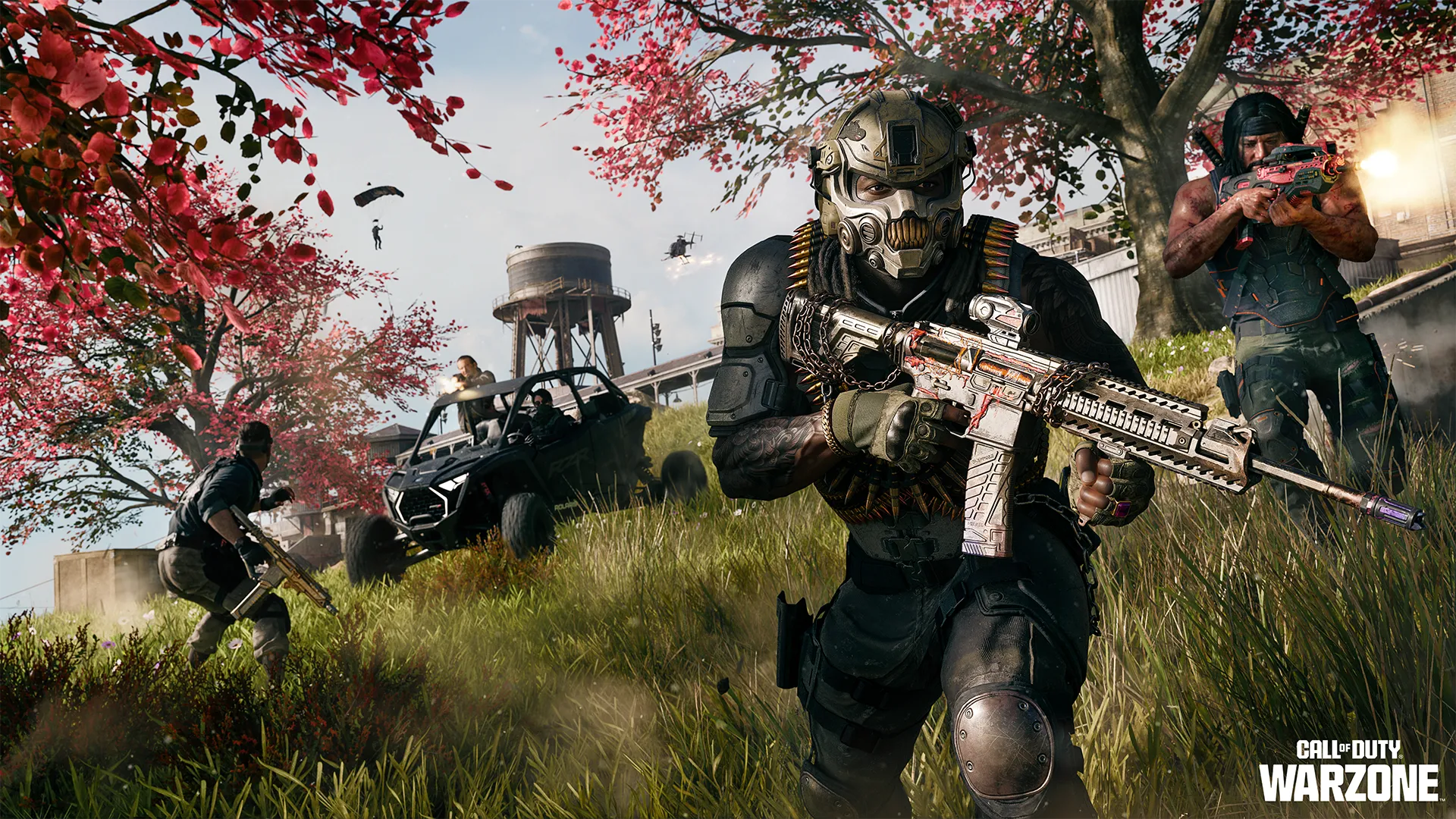 Armored operator advances through a grassy battlefield as teammates, vehicles, and helicopters engage nearby.