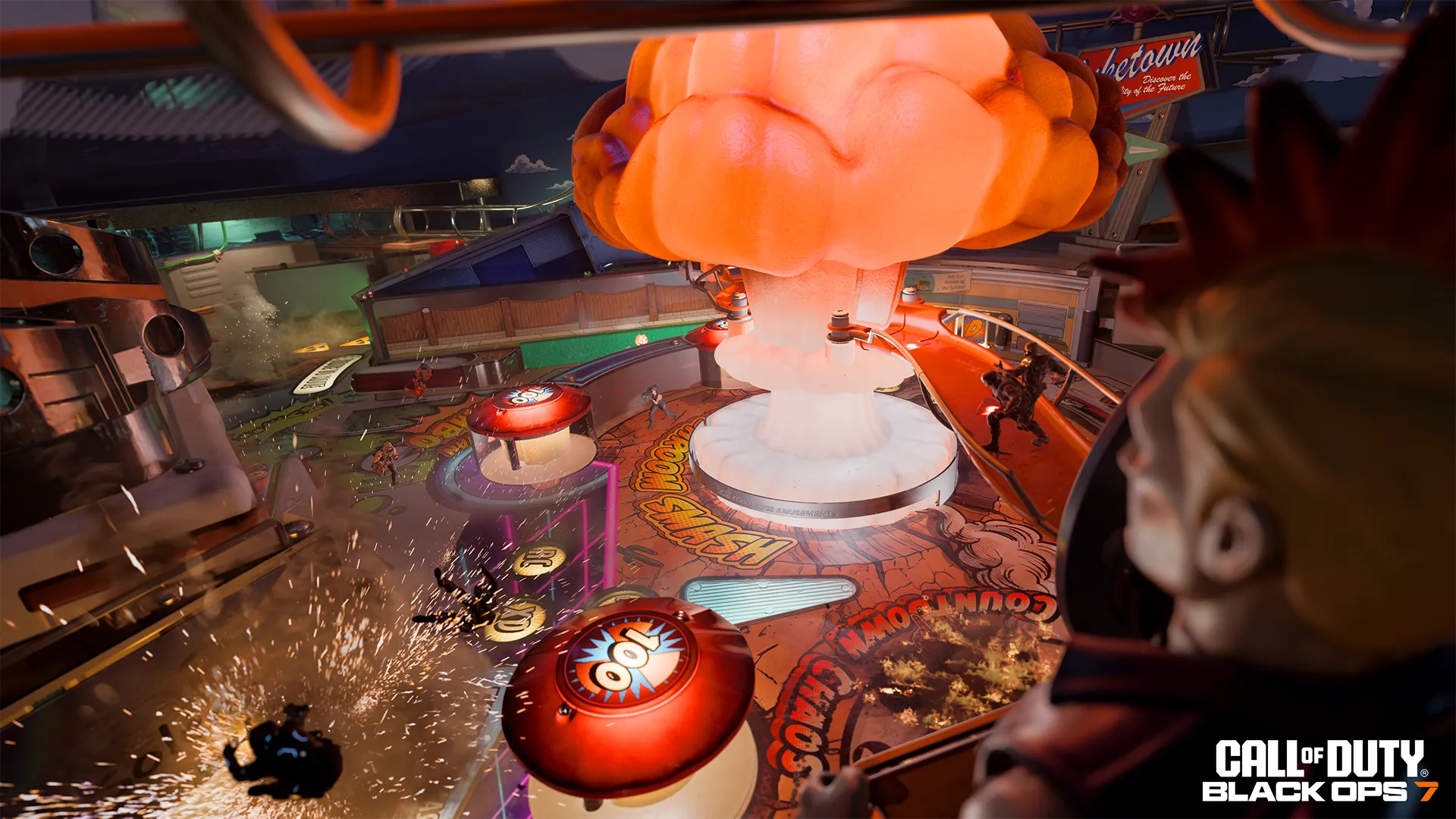 Operators fight across the oversized Turbo Tilt pinball table beneath its glowing mushroom cloud centerpiece.