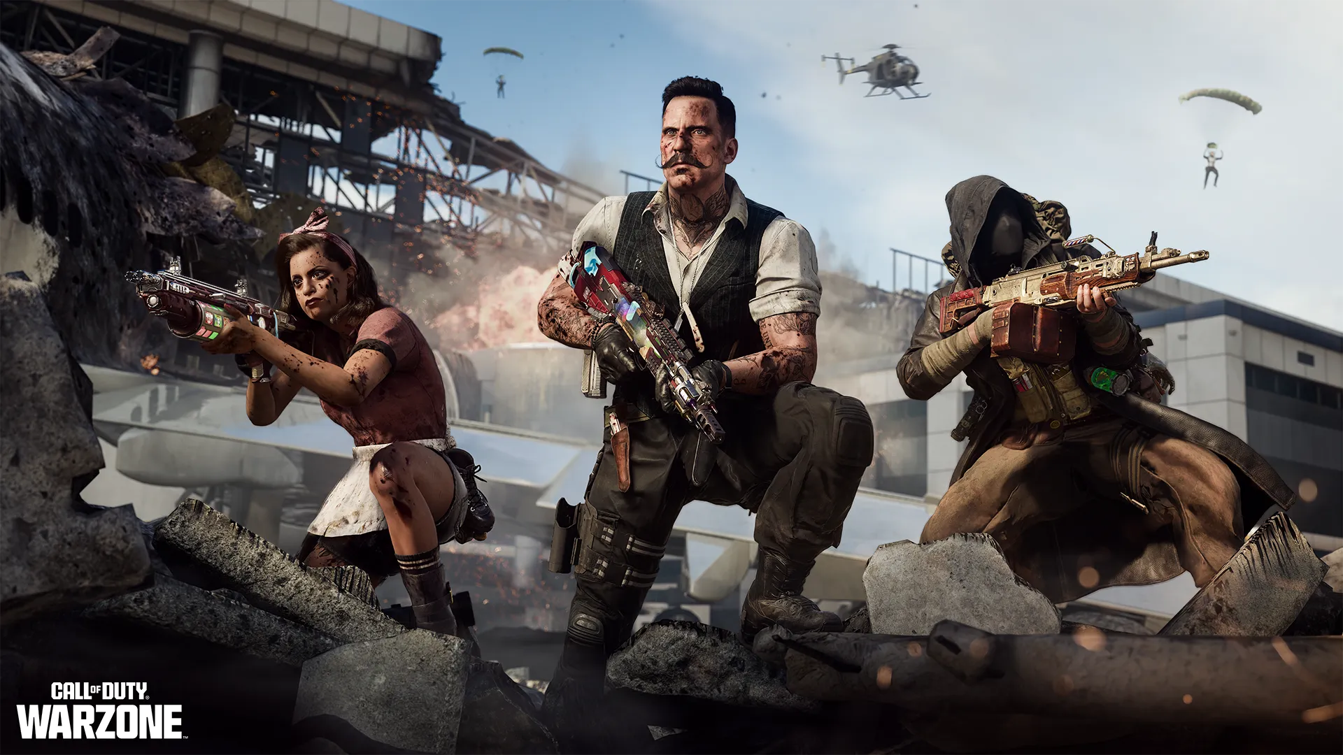 Three armed operators pose on rubble as parachutists and a helicopter descend behind them.