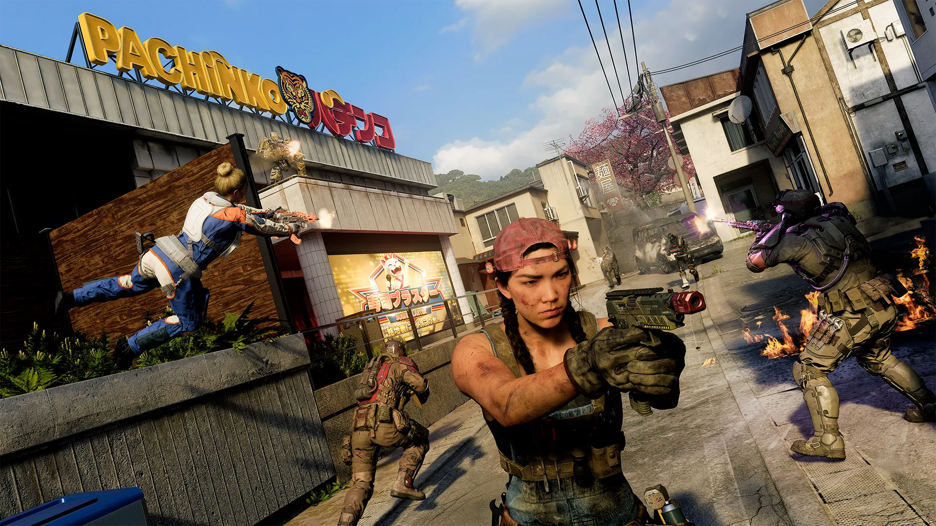 Operators exchange gunfire outside a pachinko arcade as one player advances with a pistol down the street.