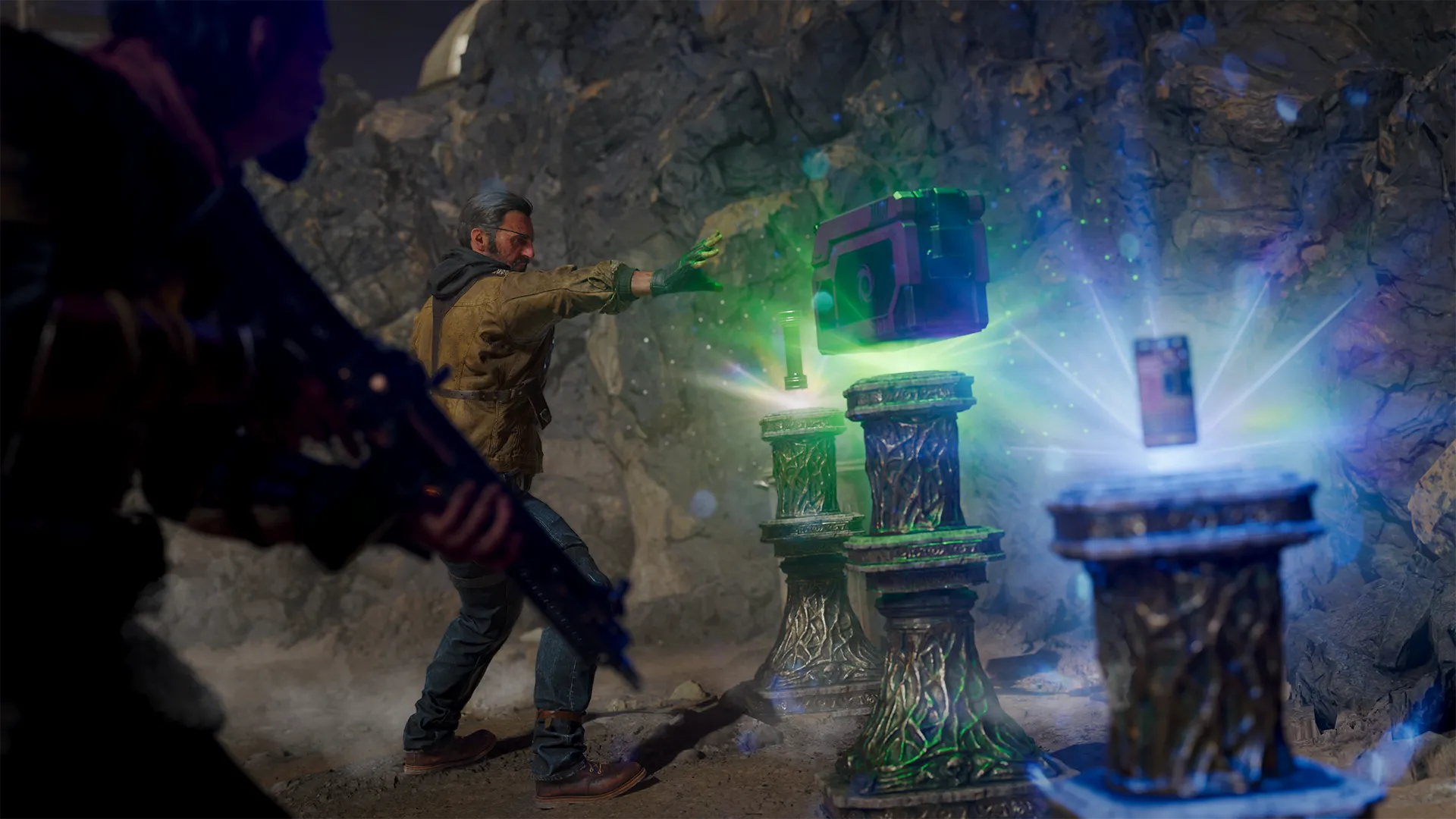 A character reaches toward floating artifacts glowing with green and blue energy inside a rocky chamber.