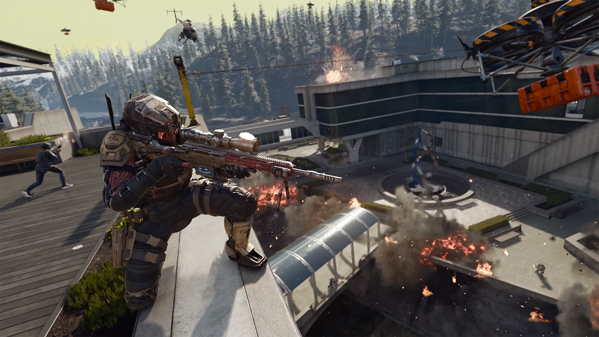 A sniper overlooks the Drone Labs battlefield as explosions erupt and supply drones fly overhead.
