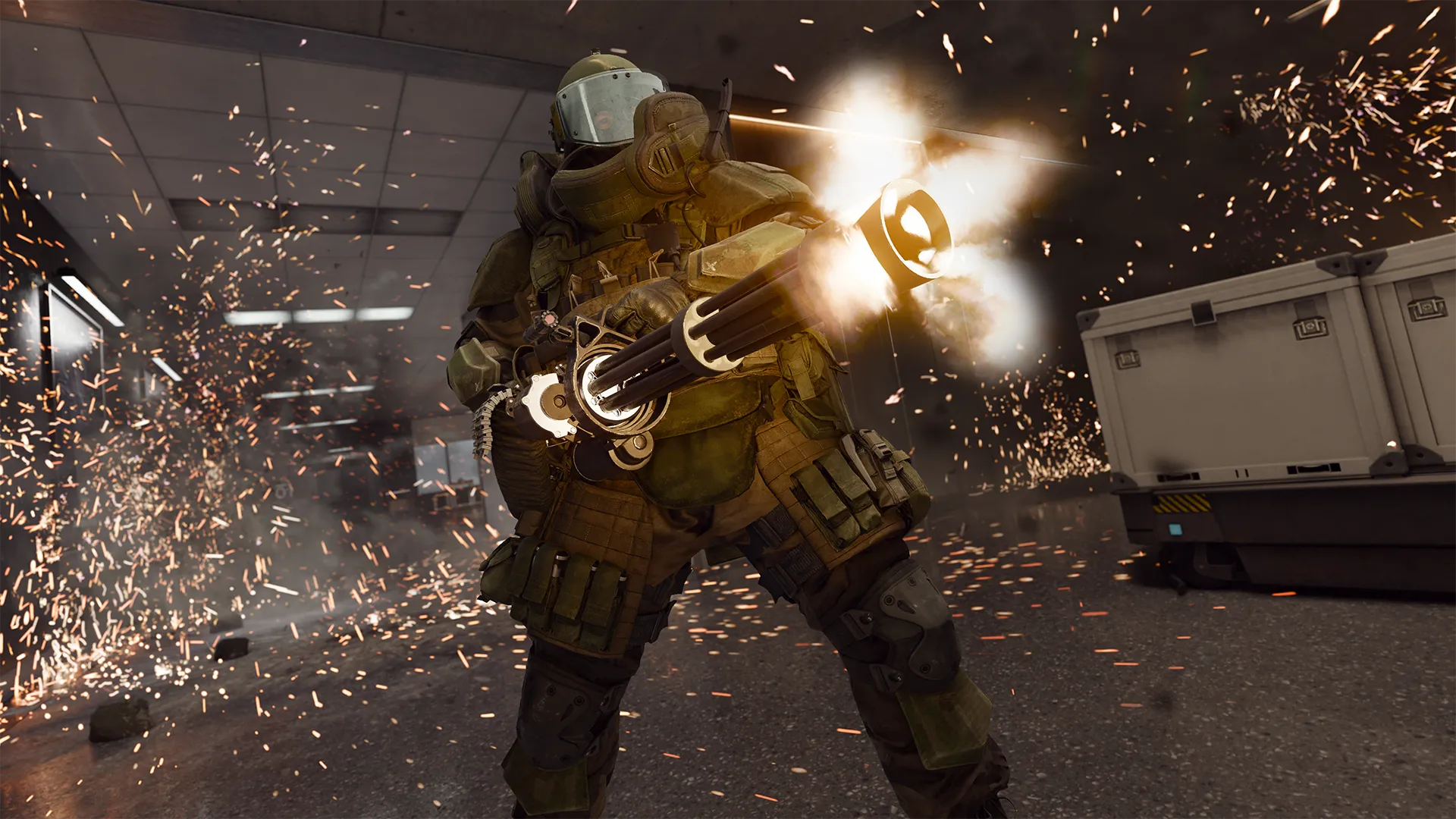 A heavily armored operator fires a minigun indoors as sparks and debris fill the room.