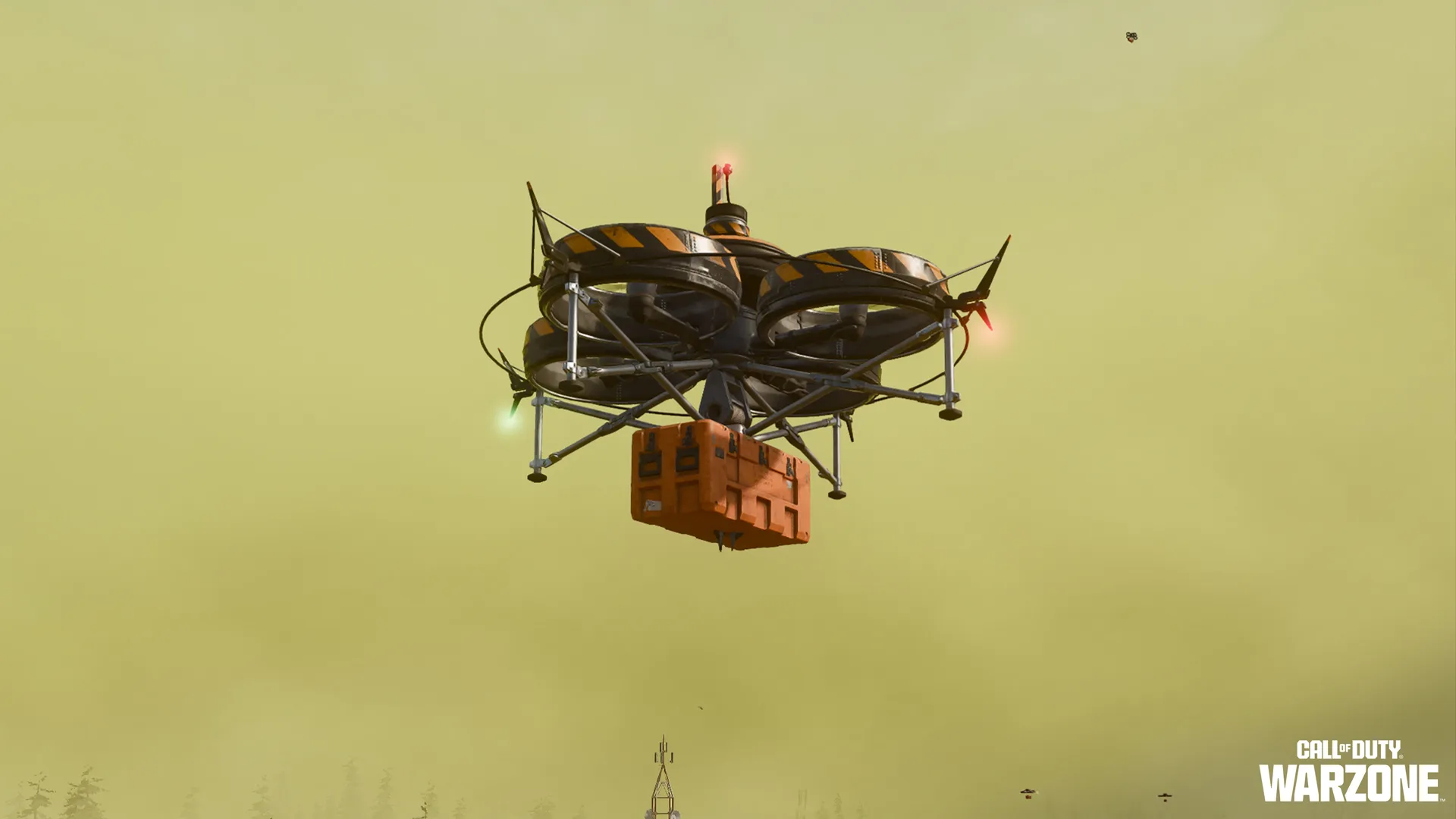Quad-rotor drone carries an orange supply crate through a hazy yellow sky.
