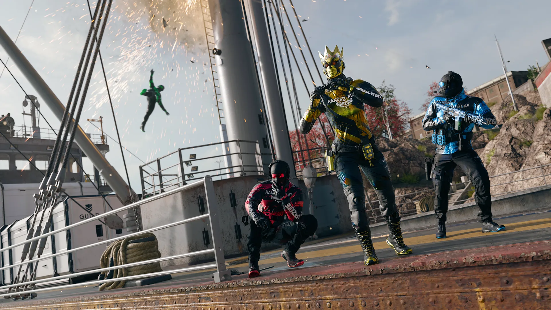 Three Ranked Play operators pose on a dock as an explosion launches an enemy into the air behind them.