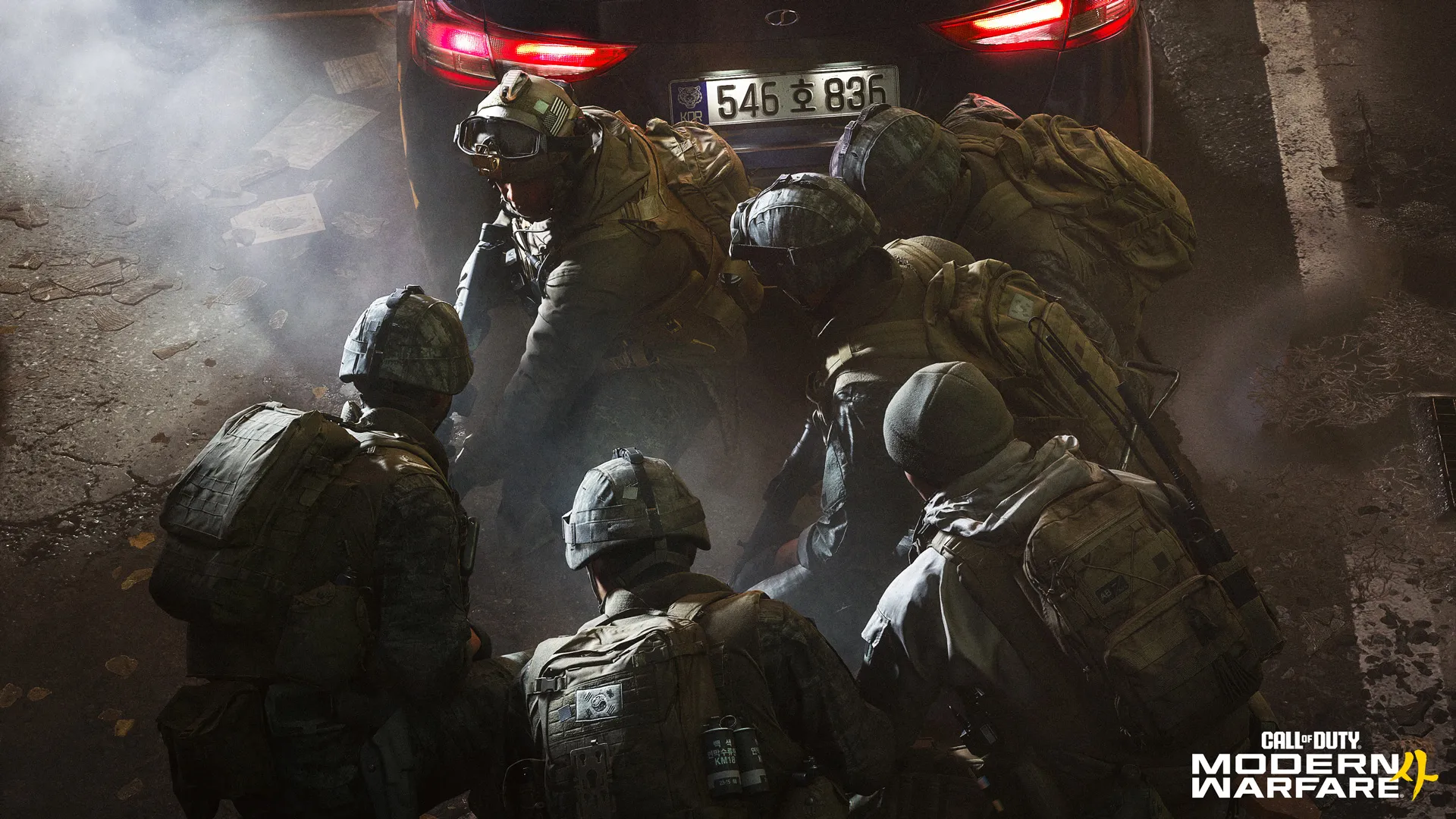 Six South Korean soldiers in tactical gear gather behind a black vehicle amid smoke, with the Modern Warfare 4 logo below.