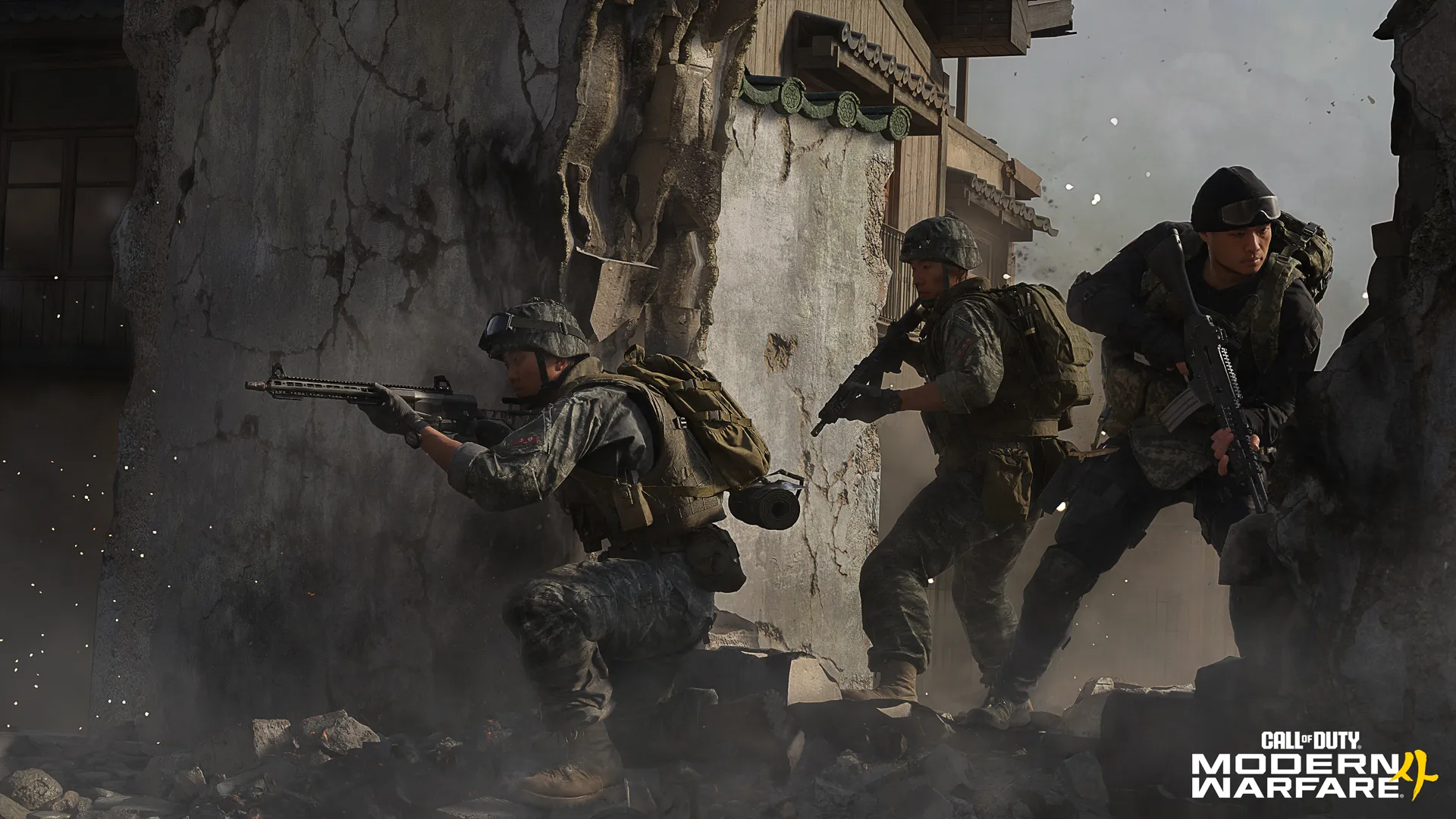 Three soldiers move cautiously through the rubble of a damaged street with weapons raised.