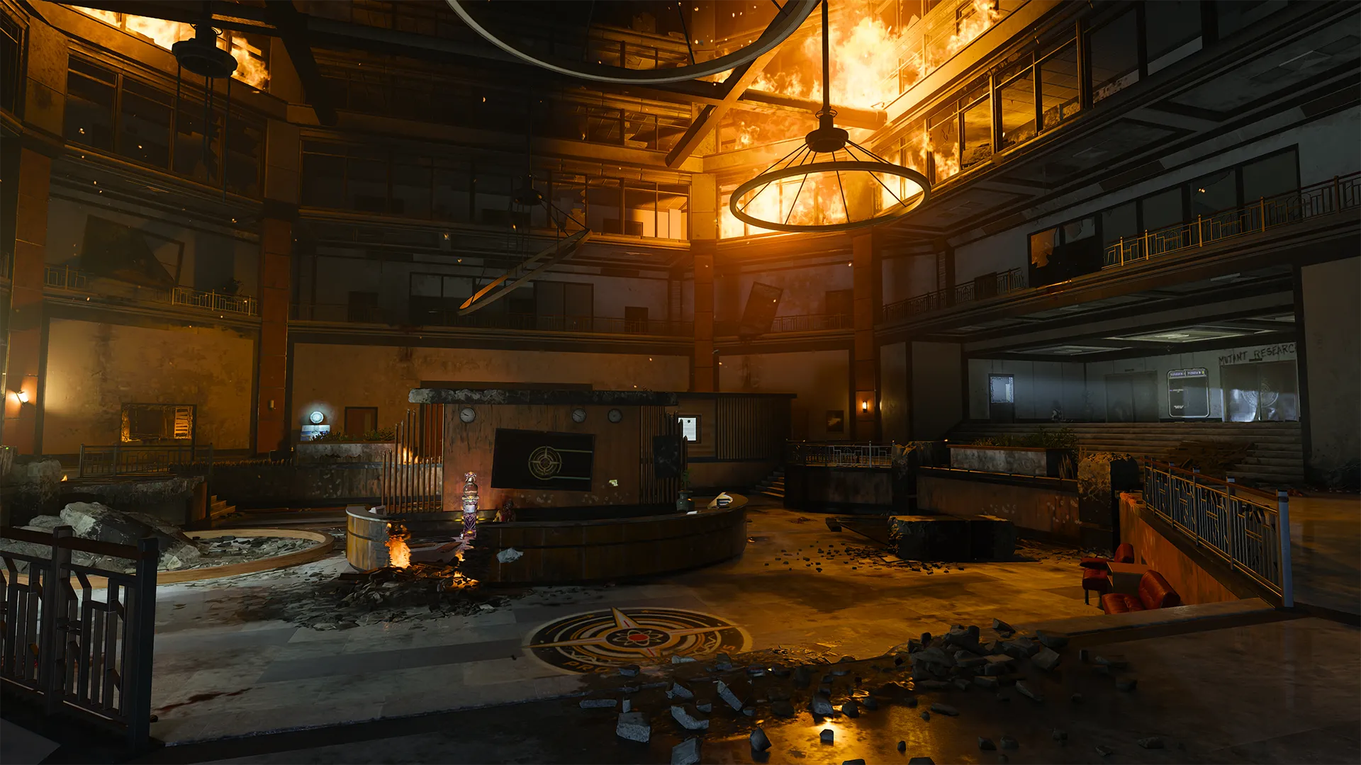 A large, scorched lobby with cracked floors and broken furniture is lit by a raging fire consuming the upper levels, while the reception desk and signage hint at a facility tied to mutant research.