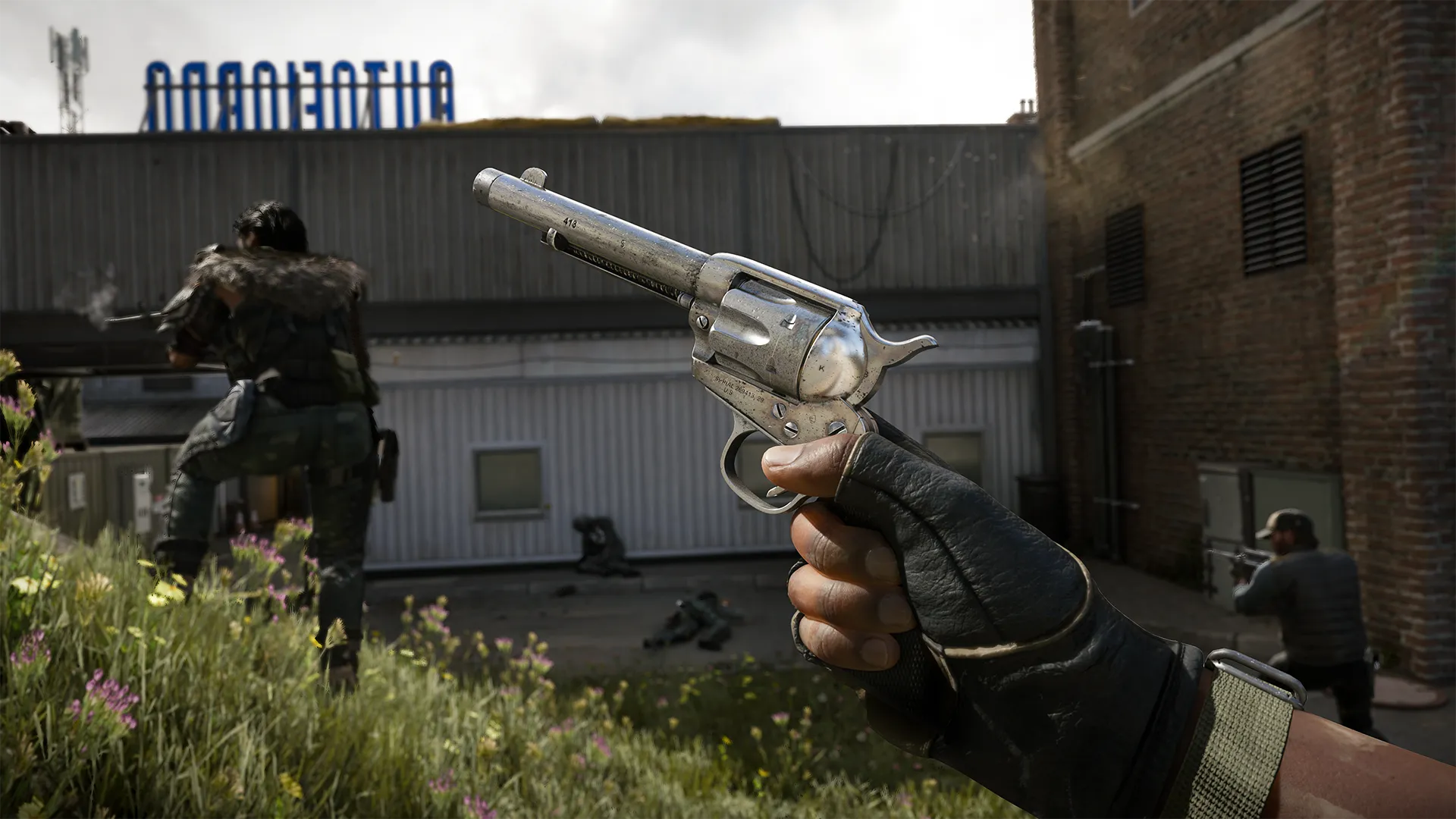 A gloved hand holds a silver revolver in the foreground, aimed upward, while armed soldiers engage in combat near a building marked "Autofiorno" in the background. (Alt text by ChatGPT)